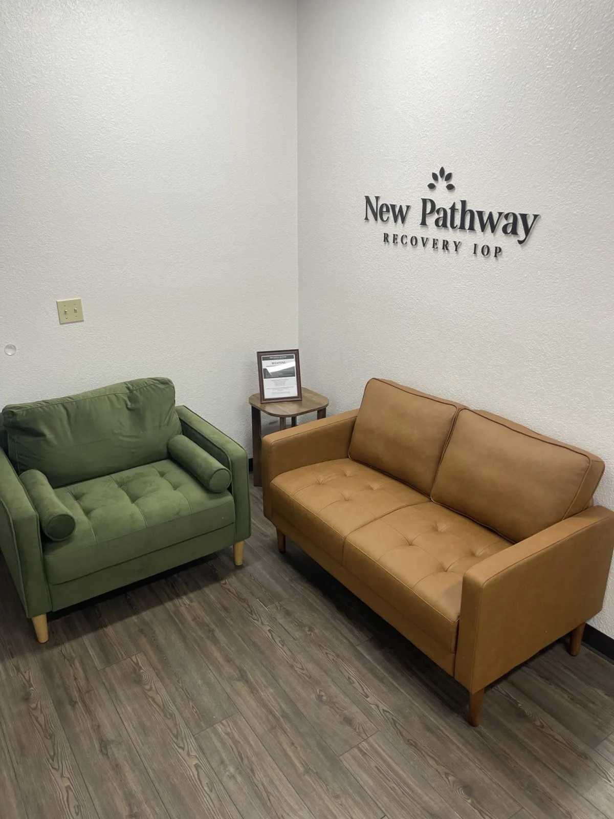 New Pathway Recovery IOP lounge with green and tan sofas